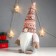 Interior light doll "Santa Claus Luminous nose, in a pink cap with patterns" 33x17x12 cm