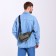 Male sling bag from textiles, headphones, green color