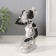Polystone souvenir "African in a dress with leaves, with a jug, sits" silver 10.5x9x16 cm