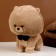 Soft toy "Dog" with a butterfly, 22 cm, beige color