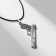 Pendant Pistol's pendant Pattern, color black silver on a black lace, 50 cm