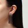 Hanging earrings with rhinestones "Waterfall" gradient, soft square, white-gray color in gold, 5.7 cm
