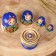 Matryoshka "God's cow", blue dress, 5 puppet, 9-10 cm