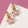 Clips children's “chosen” flower with pearls, white-peach color in gold