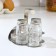 A set of glass spices on a stand, 4 items: a solo, a lobby, a napkin, a tank capacity
