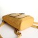 City backpack on a zipper, mustard color