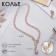The necklace is “pearl” with a flipping element, dragonfly, pink color in gold, 50 cm