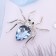 Brooch "Spider", white-blue color in silver