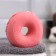 The bath bomb "Donut with coconut sprinkling", red