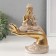 Polystone souvenir "Buddha in a white robe. At a palm" 9x16.5x22.5 cm