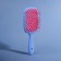 The comb is massage, wide, ventilated, 8.5 × 20.5 cm, PVC box, blue/pink color