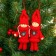 Toy - suspension "Doll in a suit", red color, mix