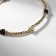 Bracelet with rhinestones "Noel" cubes, white-black color in gold