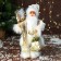 Santa Claus "with gifts and in the strap" 31 cm, white-gold
