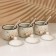 A set of ceramic cans for spices on a metal stand “Flowers”, 200 ml, 3 pcs, white color
