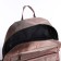 A backpack with a zipper, 5 outer pockets, pencil case, powder color