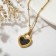Pendant "Heart" lock, black and white color in gold, 40 cm