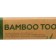 Middle bamboo toothbrush in the box, yellow