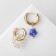 Earrings with the removable element "Transformer" flower, white-blue color in gold