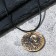 Unisex "Coin" with a skull, color black gold on a black lace, 45 cm