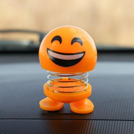Smile on the spring, on the panel in the car, laughter, yellow