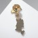 Bunny icon under an umbrella, color in gold