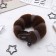 A roller with a mount and an elastic band for creating a bundle 5x22.5 cm, brown