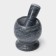 A mortar with an “marble” push, made of natural stone