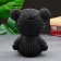 The piggy bank "Bear in the jacket" is black, gold, 19 cm