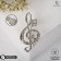 Brooch "Violin key" and notes, white color in silver