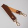 Pen for a bag made of genuine leather, with carbines, 30 ± 2 cm × 2.5 cm, brown/gold color