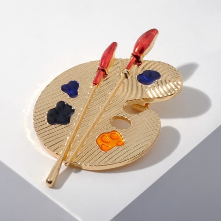 Brooch "Palette" with brushes, colored in gold