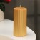 Candle-cylinder with faces, 5x10cm, gold, 6 hours