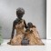 Souvenir Polystone "African with a child" under a tree 18.5x17.5x10.5 cm