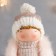 Interior doll "Baby in a fur vest and in a hat with a pompom" 27x9x12 cm