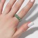 Ring "Trend" parallel, green color in silver, dimensionless (from 17 size)