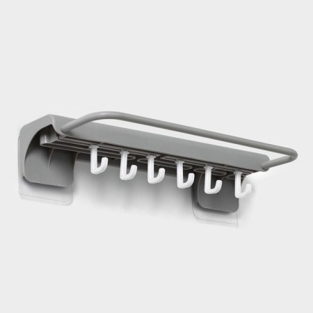 Holder for kitchen accessories with a holder for towels