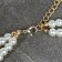 Set 2 objects: earrings, Antoinette necklace, a flash, white color in gold, 40 cm