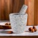 A mortar with a pestle made of stone is large, 400 ml, gray, in the box