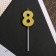 Candle for the cake, the number "8", gold.