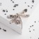 Book "Dragonfly" with a flower, the color is gray-brown in coffee gold