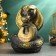 The piggy bank "Snake with the horseshoe" Black-gold, 21cm