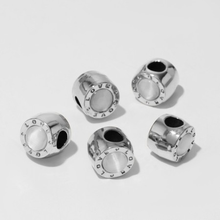 Bead "cat's eye" cylinder, white color in silver