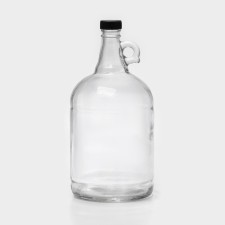 A glass bottle with a pen 