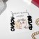 Acryl Earrings "I love to enrage", black color in silver