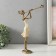 Polystone souvenir "Girl plays on the pipe, with a bird" Sand with bronze 19x6.5x27.5 cm