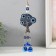 Wind music metal, plastic from the evil eye "tree from the evil eye with 3 bells" 30.5x7x2 cm