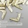 Protective corner for the album Metal "Curls" set 100 pcs gold 1.4x1.4 cm