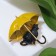 Brooch "Cat" under an umbrella, the color is black and yellow in gold