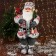 Santa Claus "In a suit with ornaments, skis and twigs" 60 cm, red-white